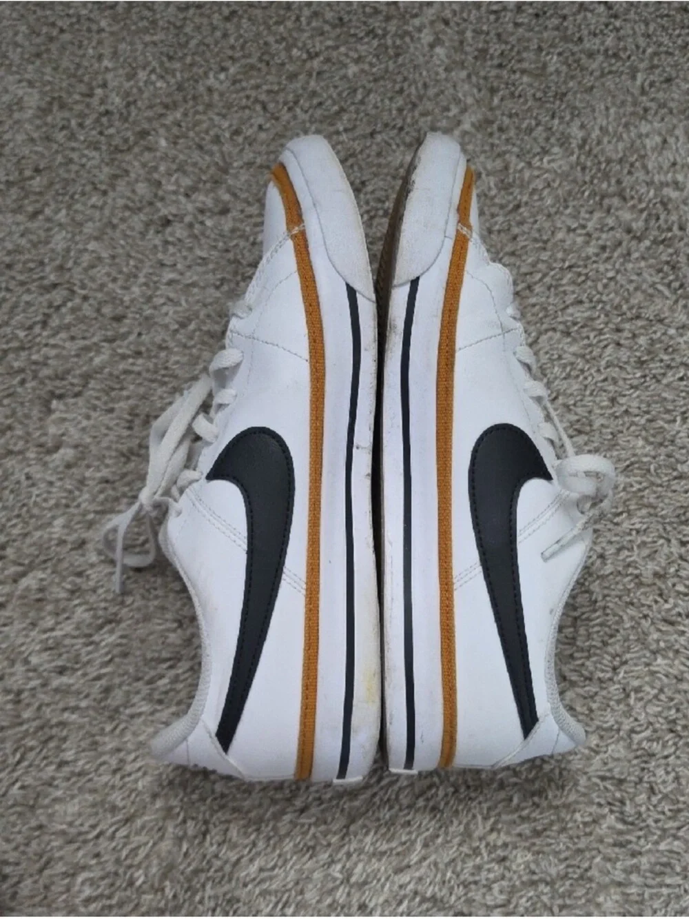 Nike White Sneakers with Black Swoosh and Tan Accent